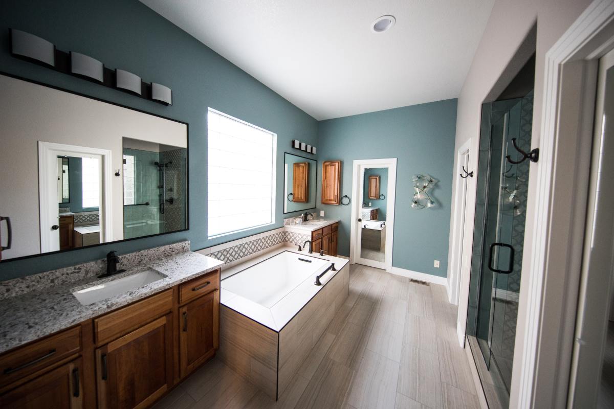 I think a Taurus would be happy with a spacious bathroom with plenty of cabinets and storage space. I'm really digging this shade of green for interior design, particularly for a Taurus template. I also love the unique design of the bathtub. 