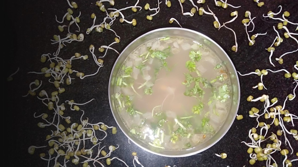 Yummy moong sprouts soup garnished with coriander leaves