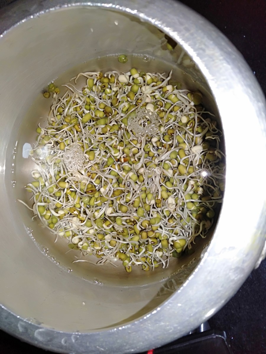 Pressure-cook moong sprouts with some water and salt. 