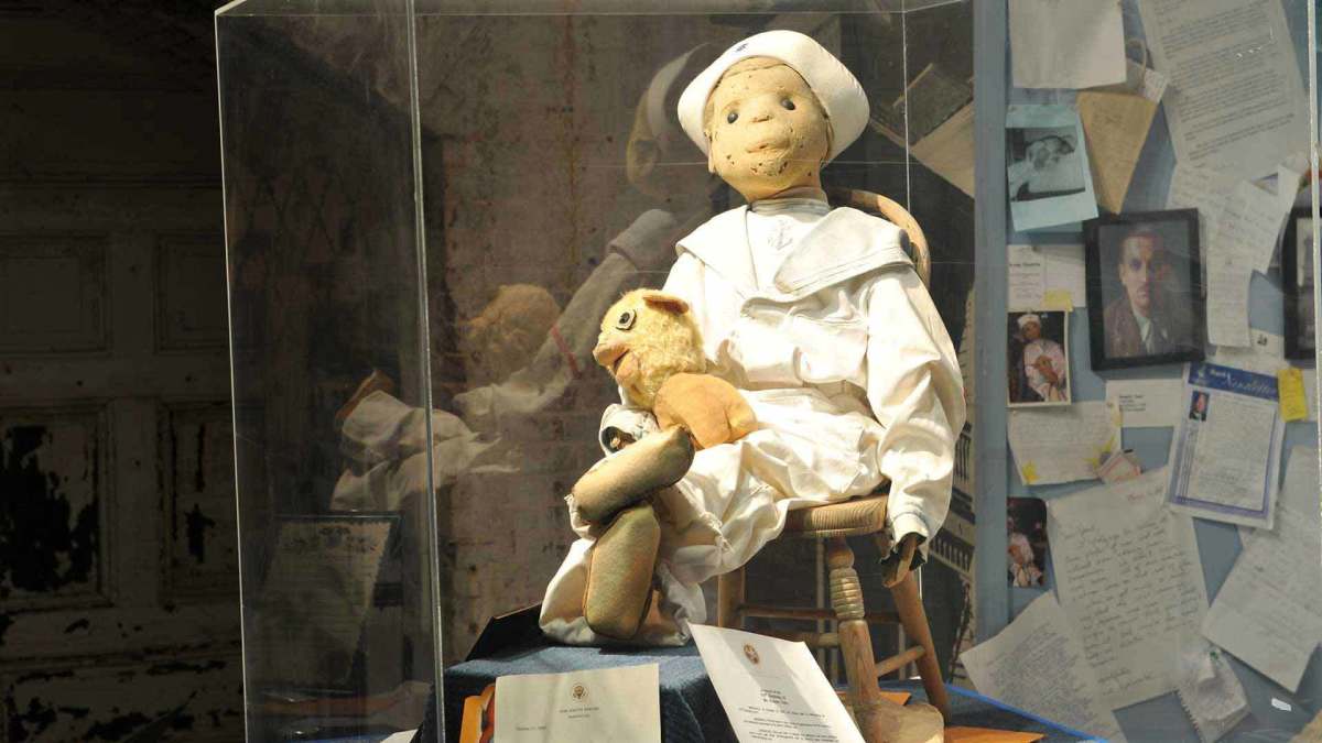 Robert the Doll and his toy pooch.