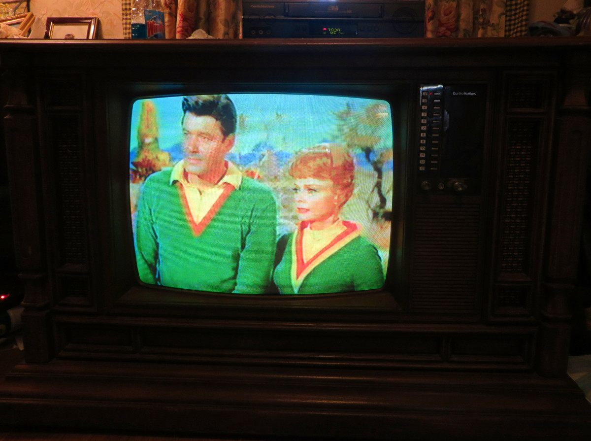 Guy Williams as Dr. John Robinson, and  June Lockhart as Maureen Robinson in Lovely Green on the Curtis Mathes Color Console Model H2508ME