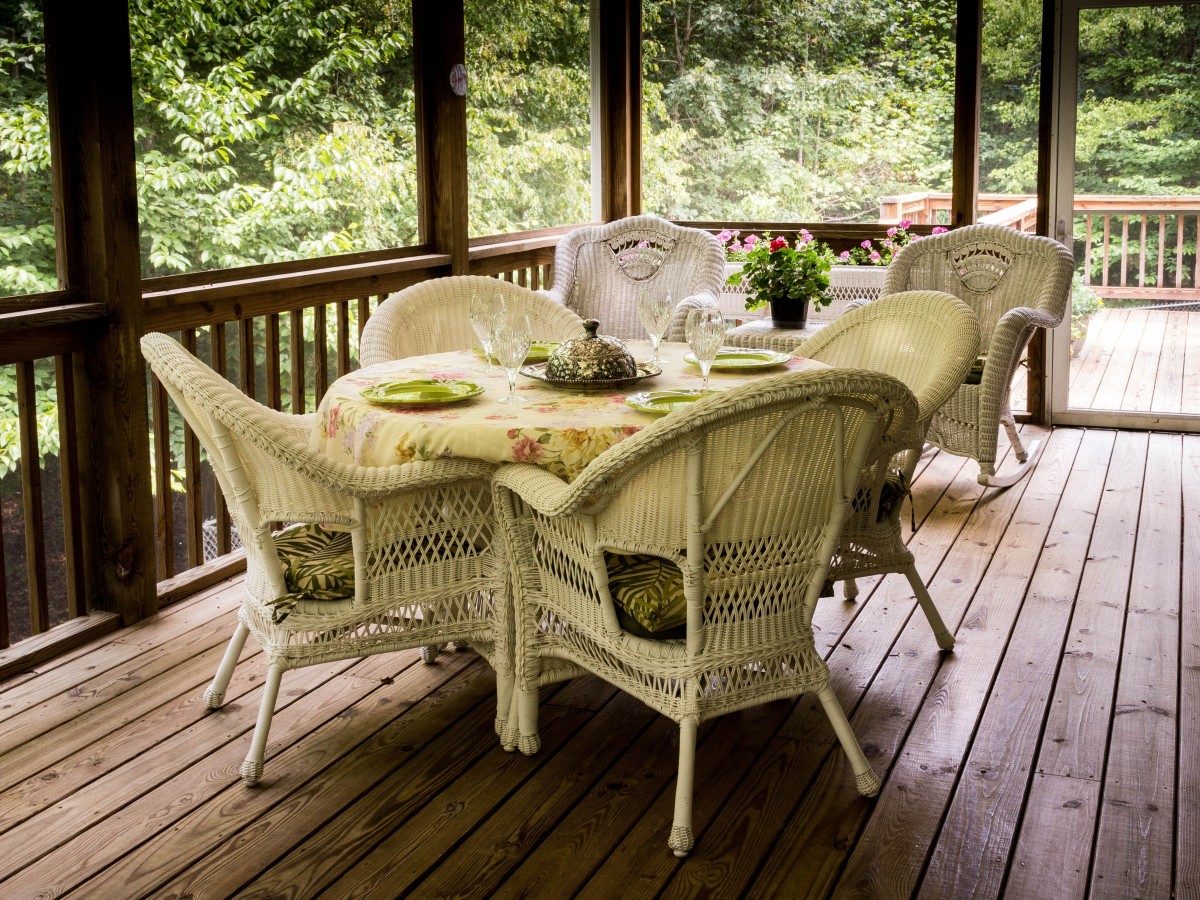 A screened porch can make for a lovely rustic retreat. It's an intentional space for relaxation.