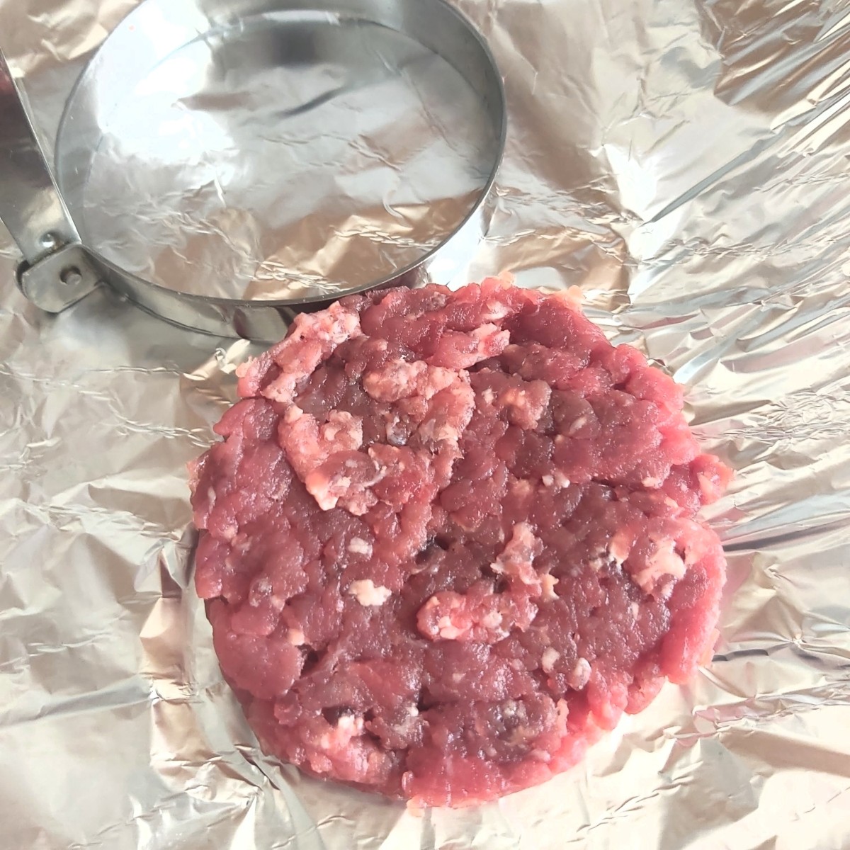 You can make beef burgers using beef sausages 