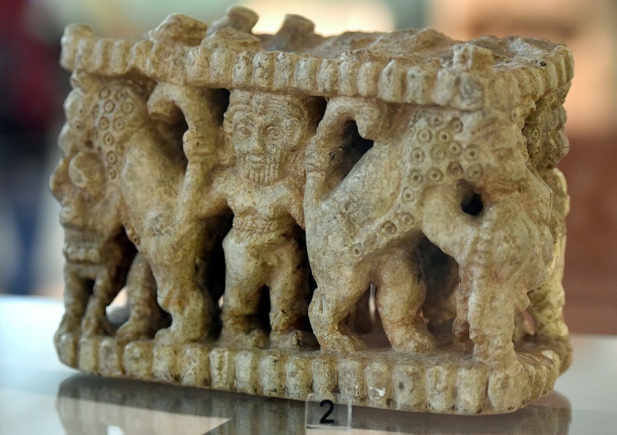 A legend is born: King Gilgamesh (center) wrestles leopards in this sculpture from ~2500 BCE, Iraq.