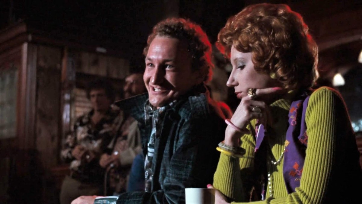 Marty (Robert Englund) and Sheila make themselves comfortable at JNH's table