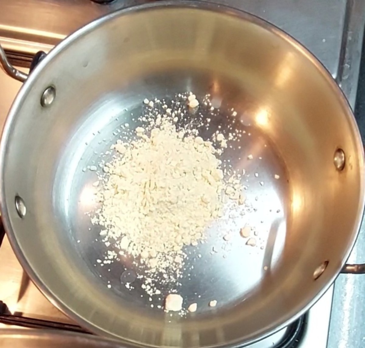 In a frying pan, add 1 1/2 teaspoon besan flour and fry till the raw smell goes away (about 5 minutes). Transfer to a plate and set aside.