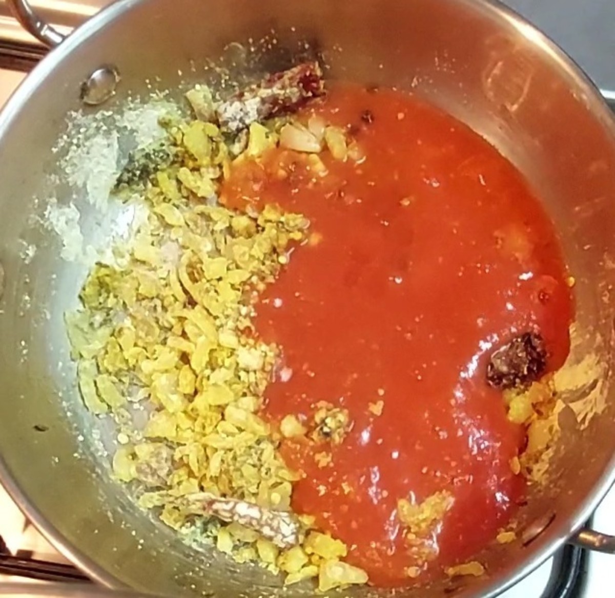 Add prepared tomato puree and mix well.