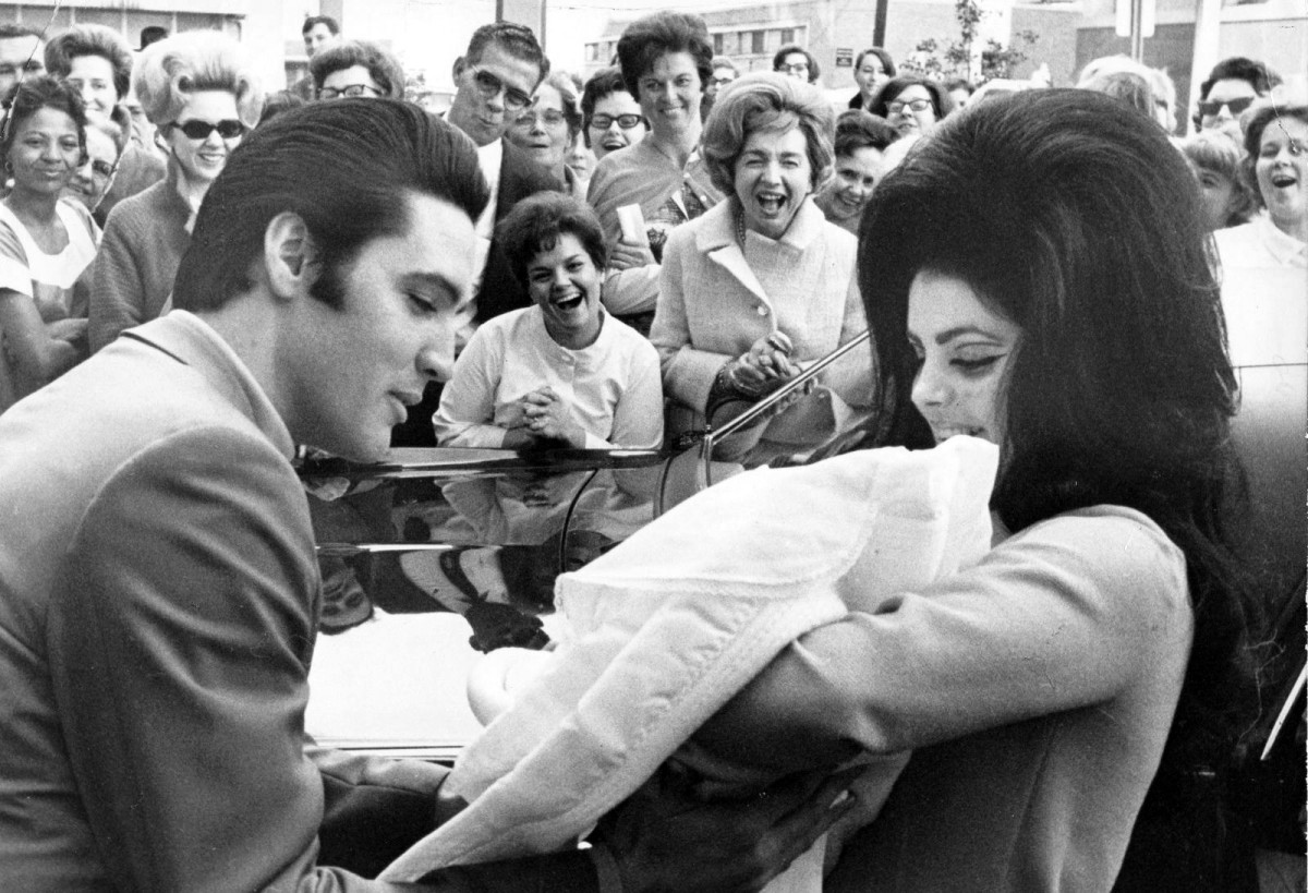 Elvis Presley and Priscilla with Lisa Marie, February 1968.