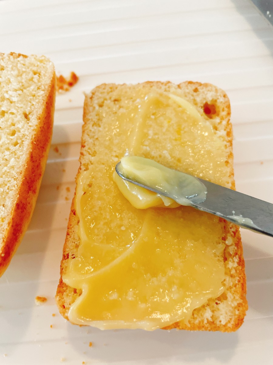 Use an icing spatula to spread the lemon curd on each loaf. Then place reassemble the loaf like a sandwich.