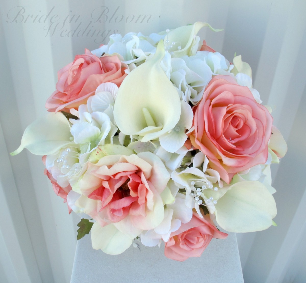If you want a little color with your calla lily bouquet, add roses for a light touch of color