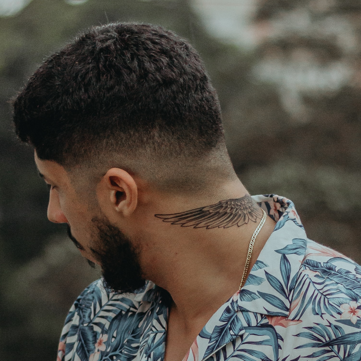 Wing Tattoo on the Back of the Neck