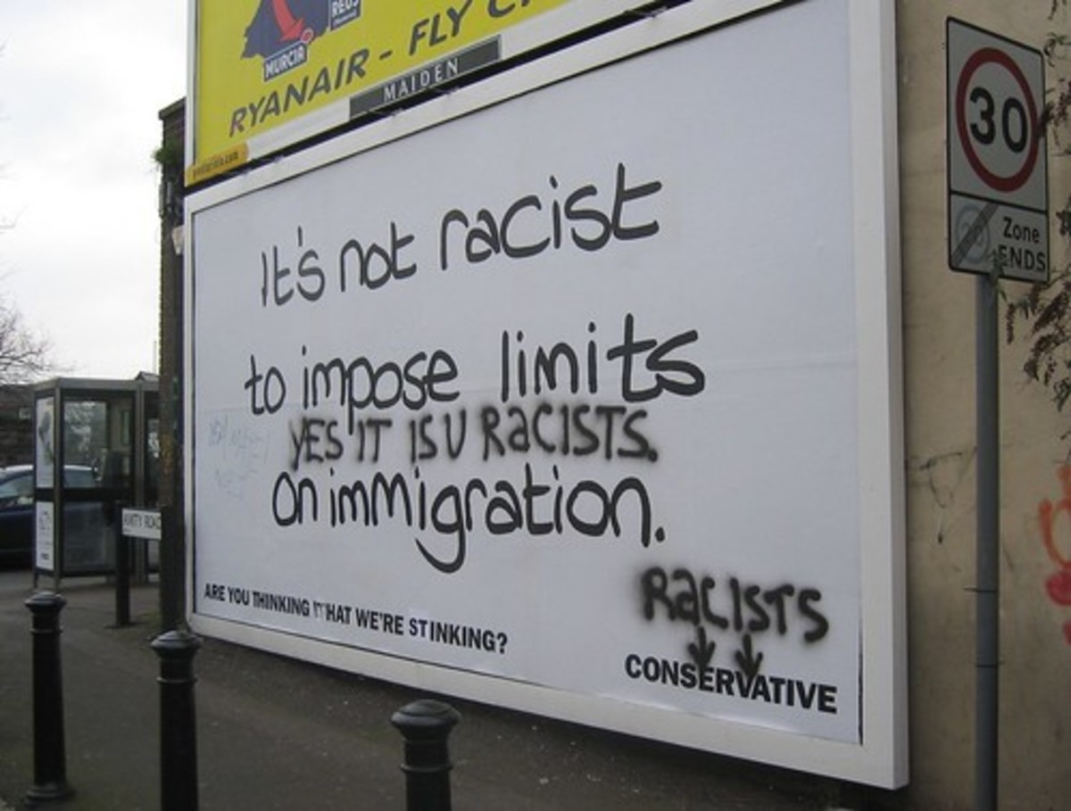 A vandalized billboard accusing right-wingers of being racist.