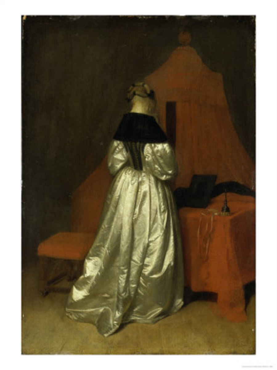 Lady in a white satin dress in front of a canopy bed.