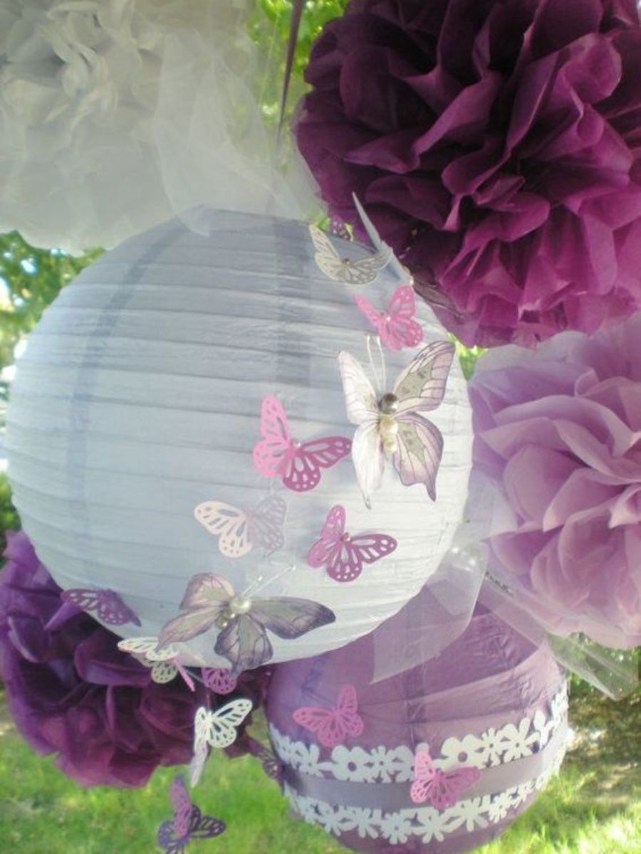 Take a simple party lantern and add cut or punched butterflies. Terrific for an outdoor wedding