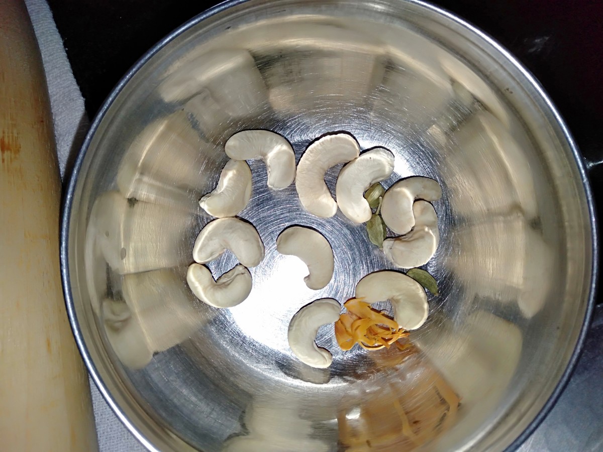 Place 12 cashews, 3 green cardamon pods and ¼ mace in bowl.
