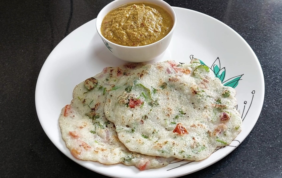 Once the chilla is well cooked, remove it from the tawa and transfer it to a plate. Repeat the same procedure and make chillas from the remaining batter. Serve with onion tomato chutney and enjoy.