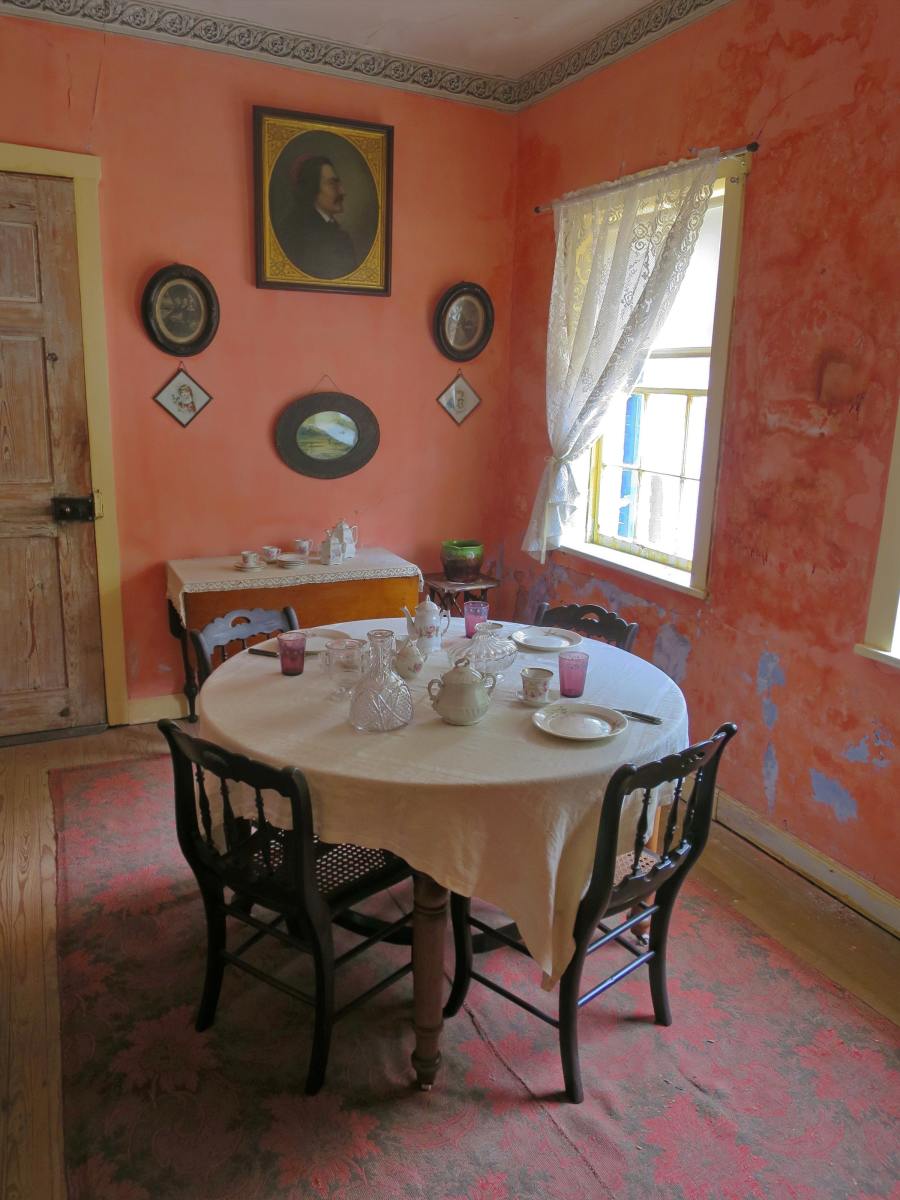 Libra's dining room should look quaint, cozy, and perfect for tea. You can find decorations at thrift stores. A hint of pink brings things together.