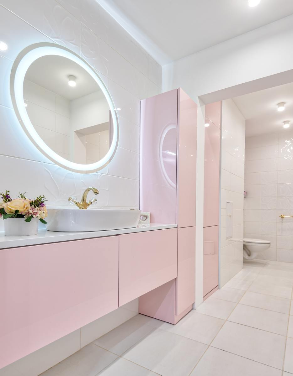 Great lighting, a bowl of flowers, and pink counters and cabinets will look divine in a Libra home. 