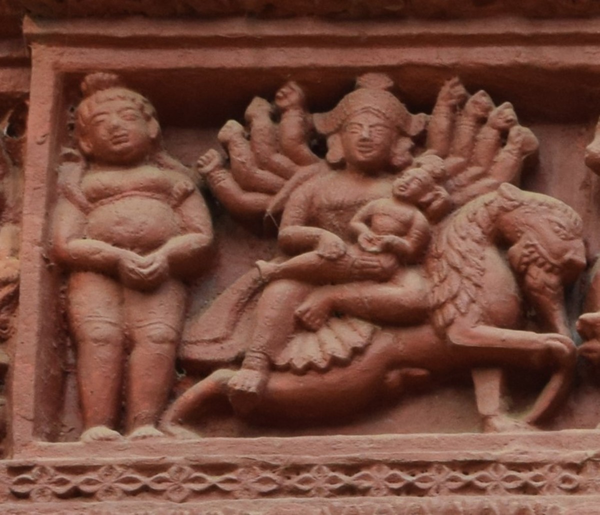 Lord Shiva and GoiddessDurga with baby Kartikeya; terracotta relief work; Rameshwar temple; Ilambazar, Birbhum; West Bengal