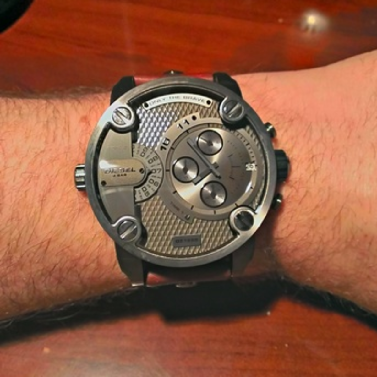 This Diesel SBA Only The Brave watch may be a little eccentric for some, but it's an eye catcher and definitely one of my favorites. At under $200 it's a good deal with it's unique watch face, functions, and calfskin strap. 