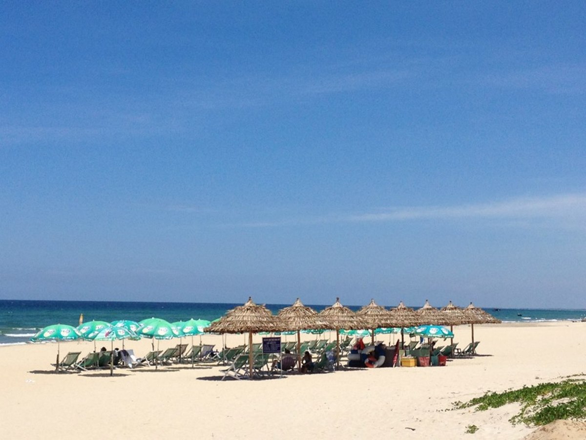 Some sun-lounges fringe along the beach to offer shade retreat from the blaring sun