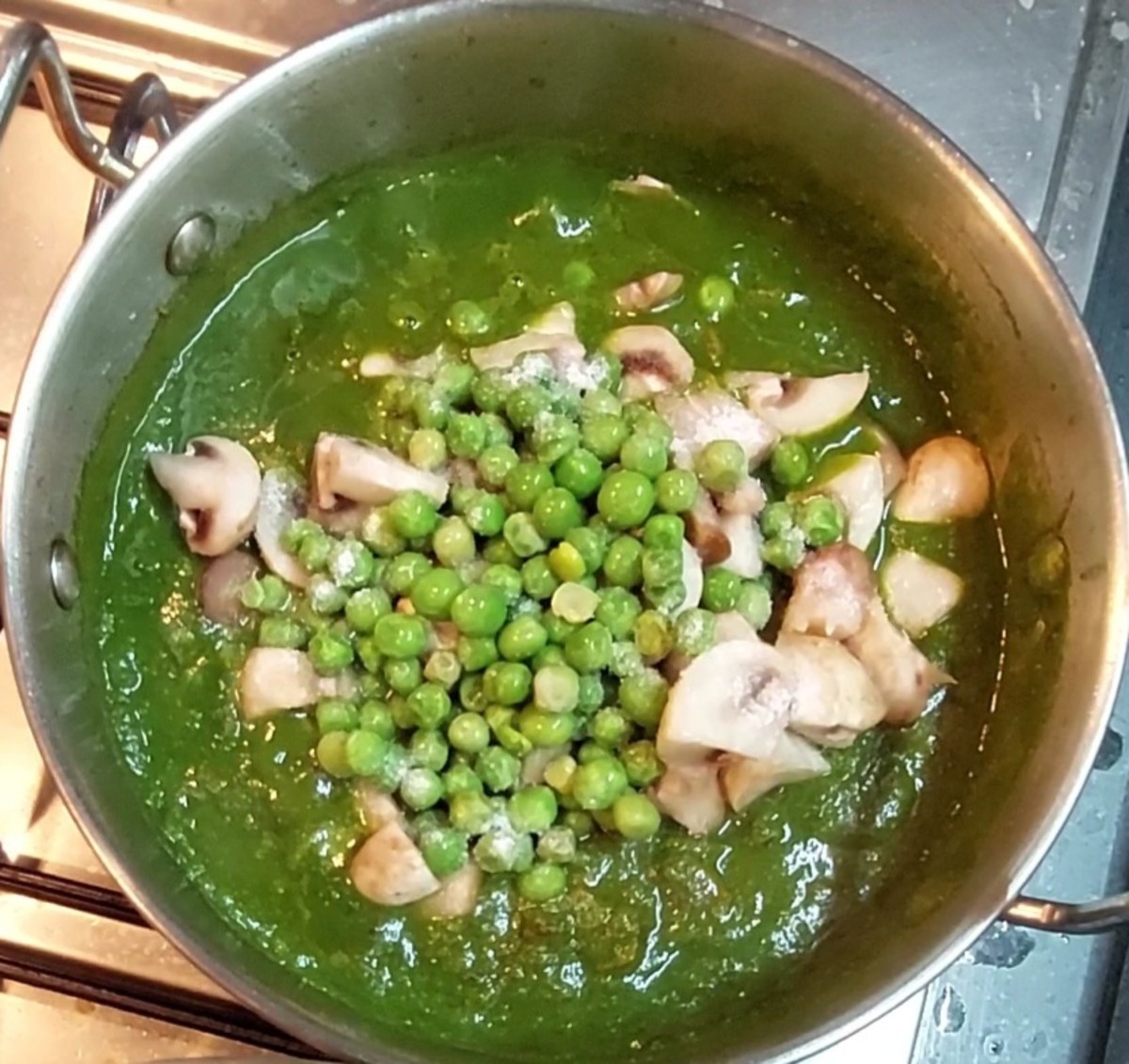 Add 200 grams chopped muhrooms and 1/4 cup peas. Add salt to taste and mix well.
