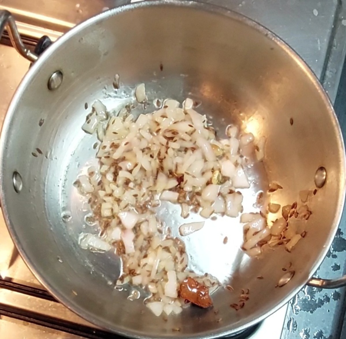 Add 1/2 cup chopped onion and fry till translucent.
