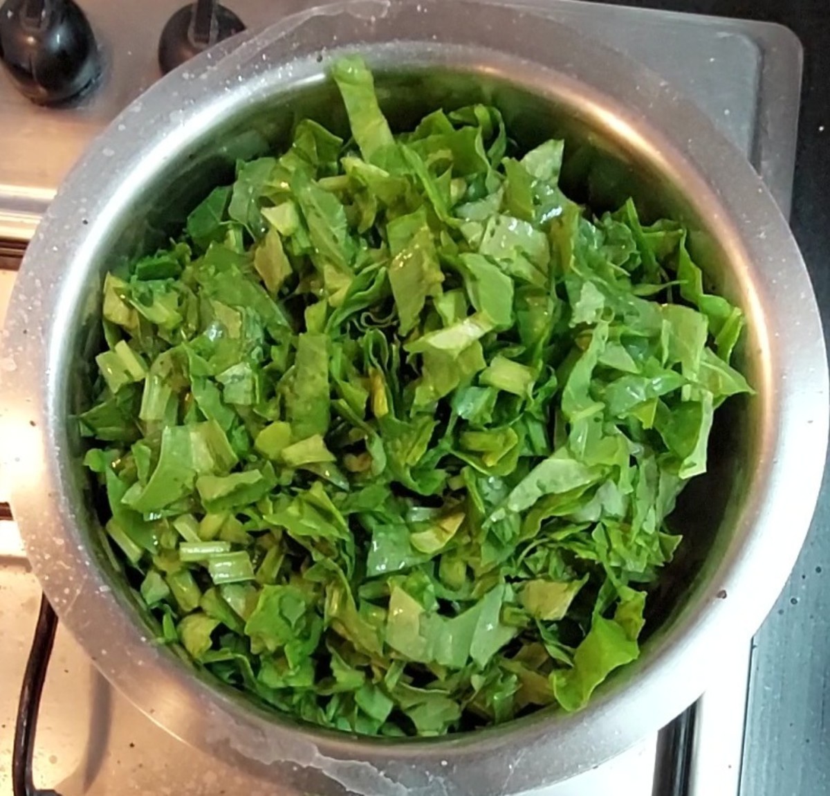 Add 250 grams washed and chopped palak leaves and tender stems.