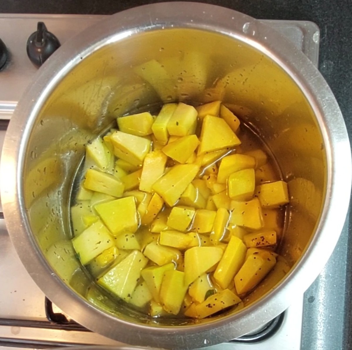Add 2 cups cubed pumpkin and saute for a minute. Add 2 cups of water, salt to taste, close the lid and cook well.