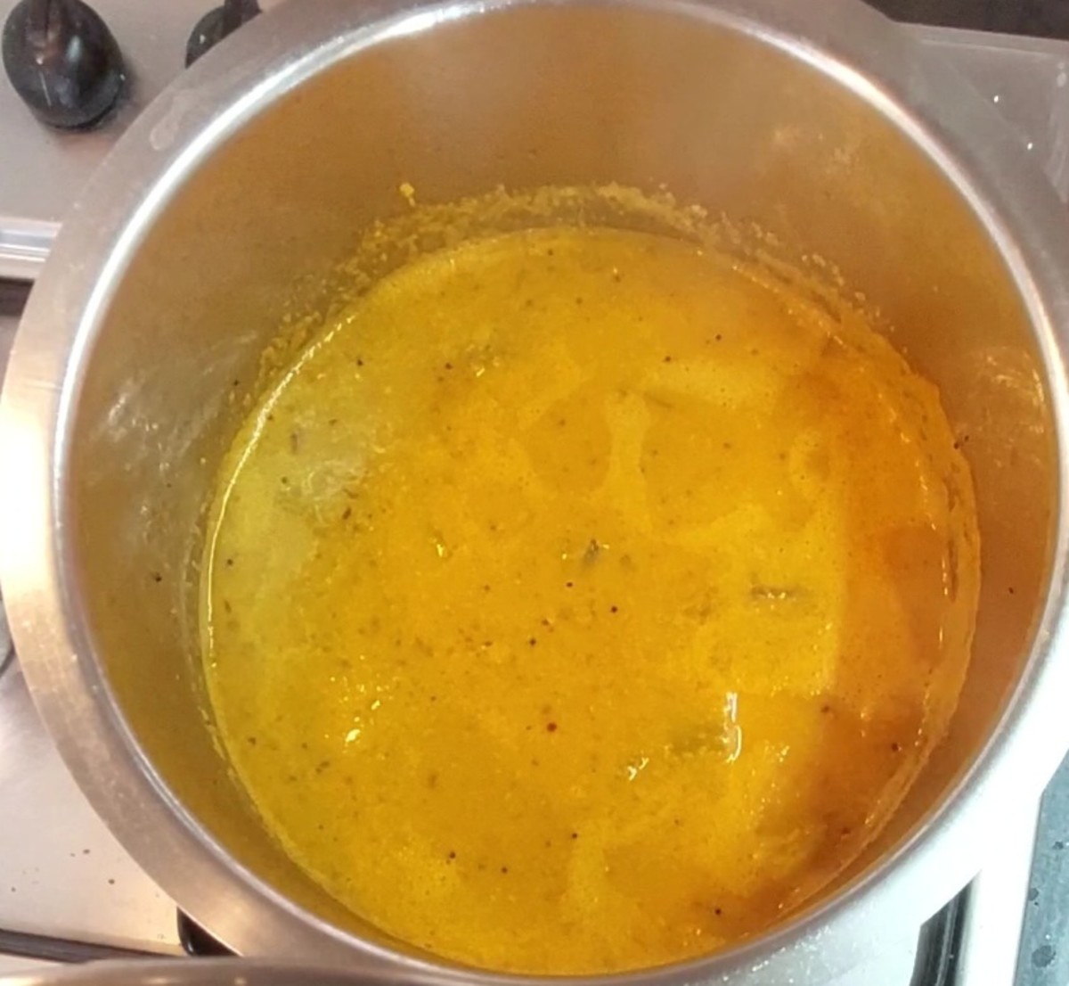 Close the lid and cook for 3-4 minutes or till raw smell of the masala vanishes. Add more water if required to adjust the consistency. Add 1 1/2 teaspoons jaggery, adjust salt and mix well. Bring it to a boil and switch off the flame.
