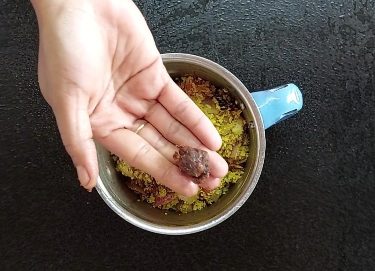 Transfer the fried ingredients to a mixer jar and add 1 teaspoon tamarind.