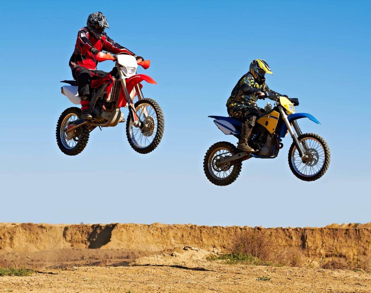 Two riders jumping