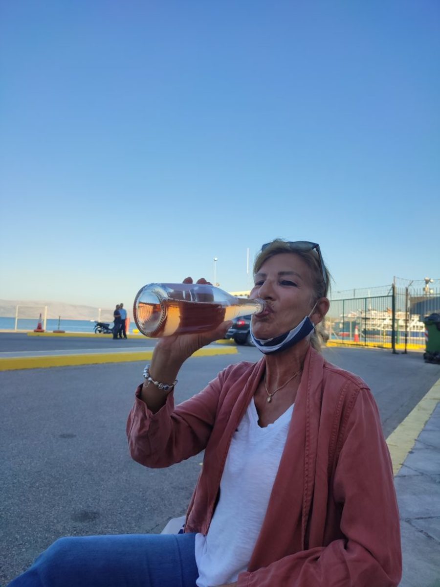 Waiting to Board the Ferry to Albania, I Felt a  Celebration was in Order. Cups were Not Available at the Duty-Free, So What Was a Girl to Do?
