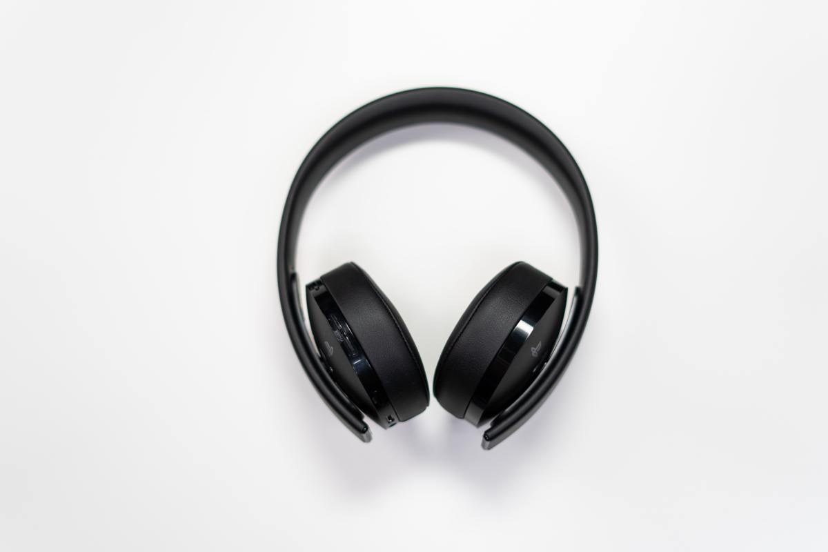 black headphones against white background 