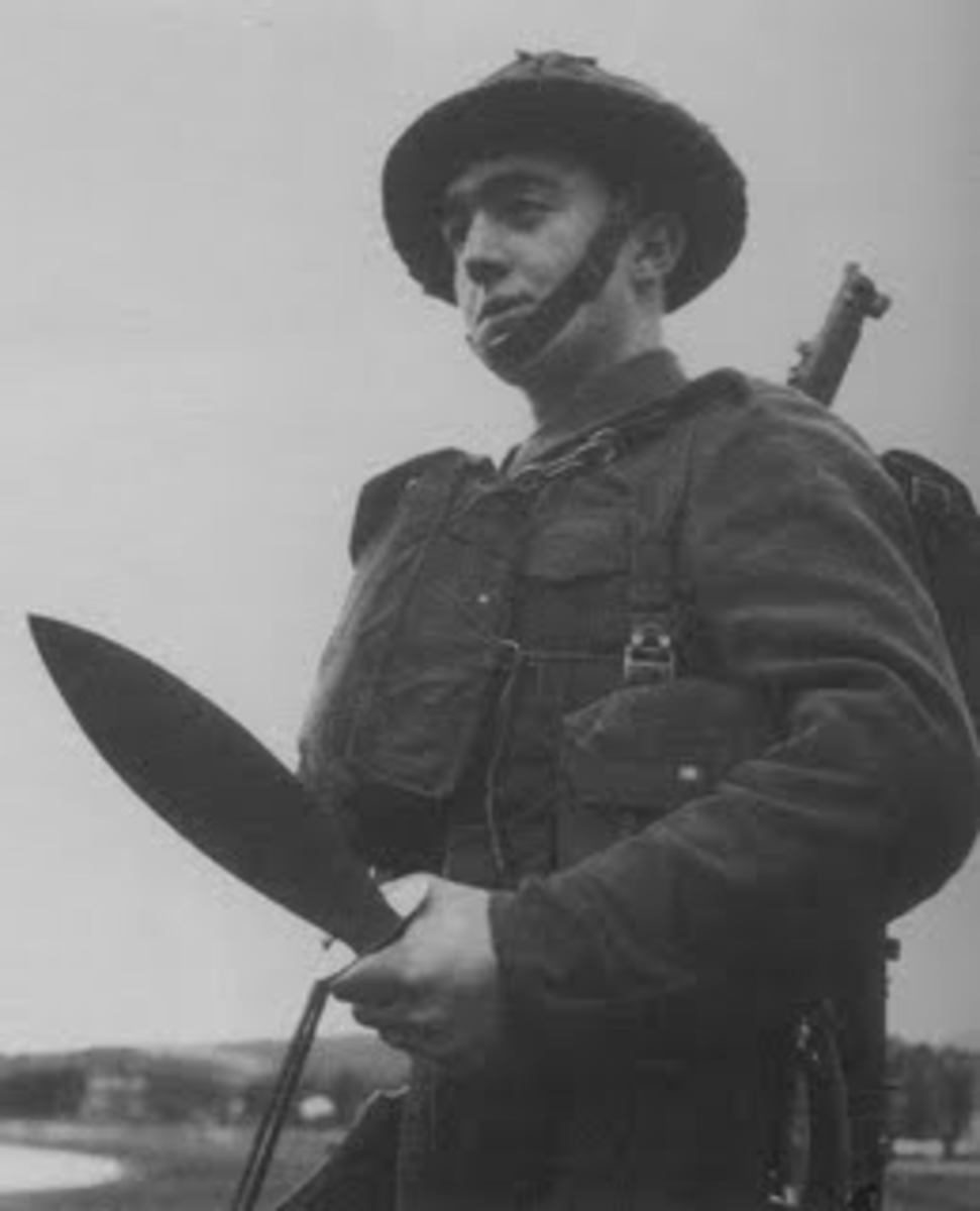 A British soldier holding a smatchet. 