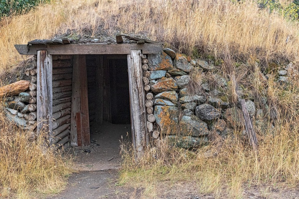 People built root cellars into a bank of dirt and supported it with large stones.