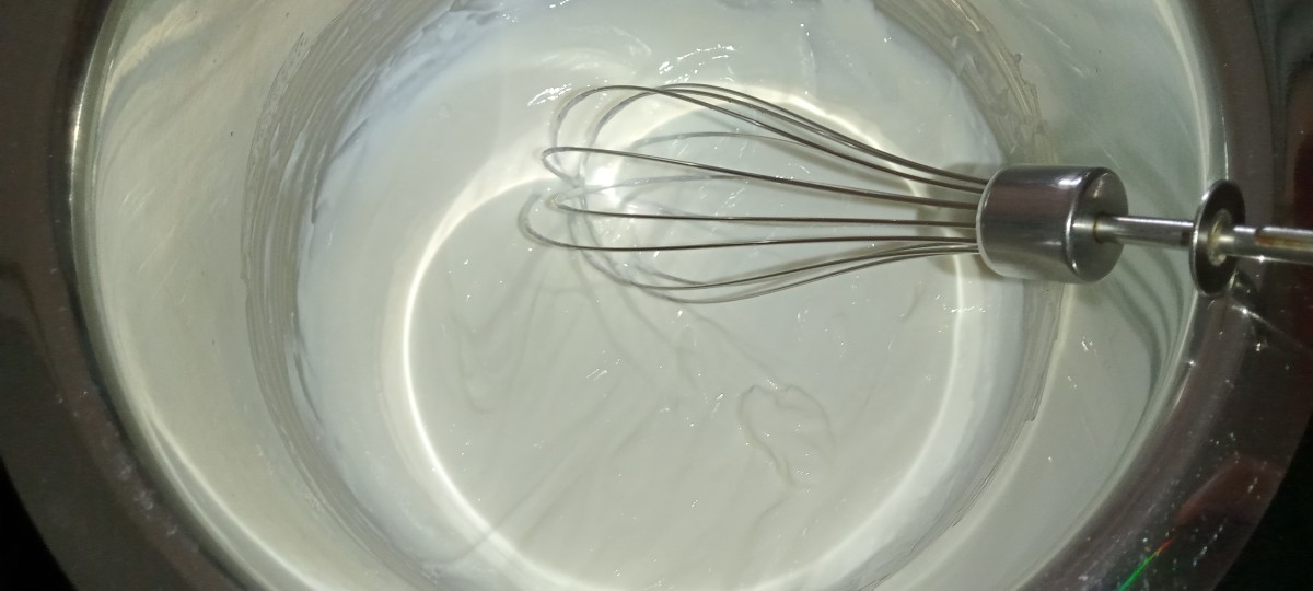 In a mixing bowl, add yoghurt and whisk it well.