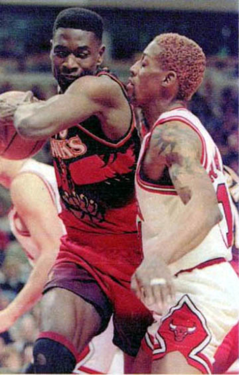 Rodman defending Dikembe Mutombo in 1996.