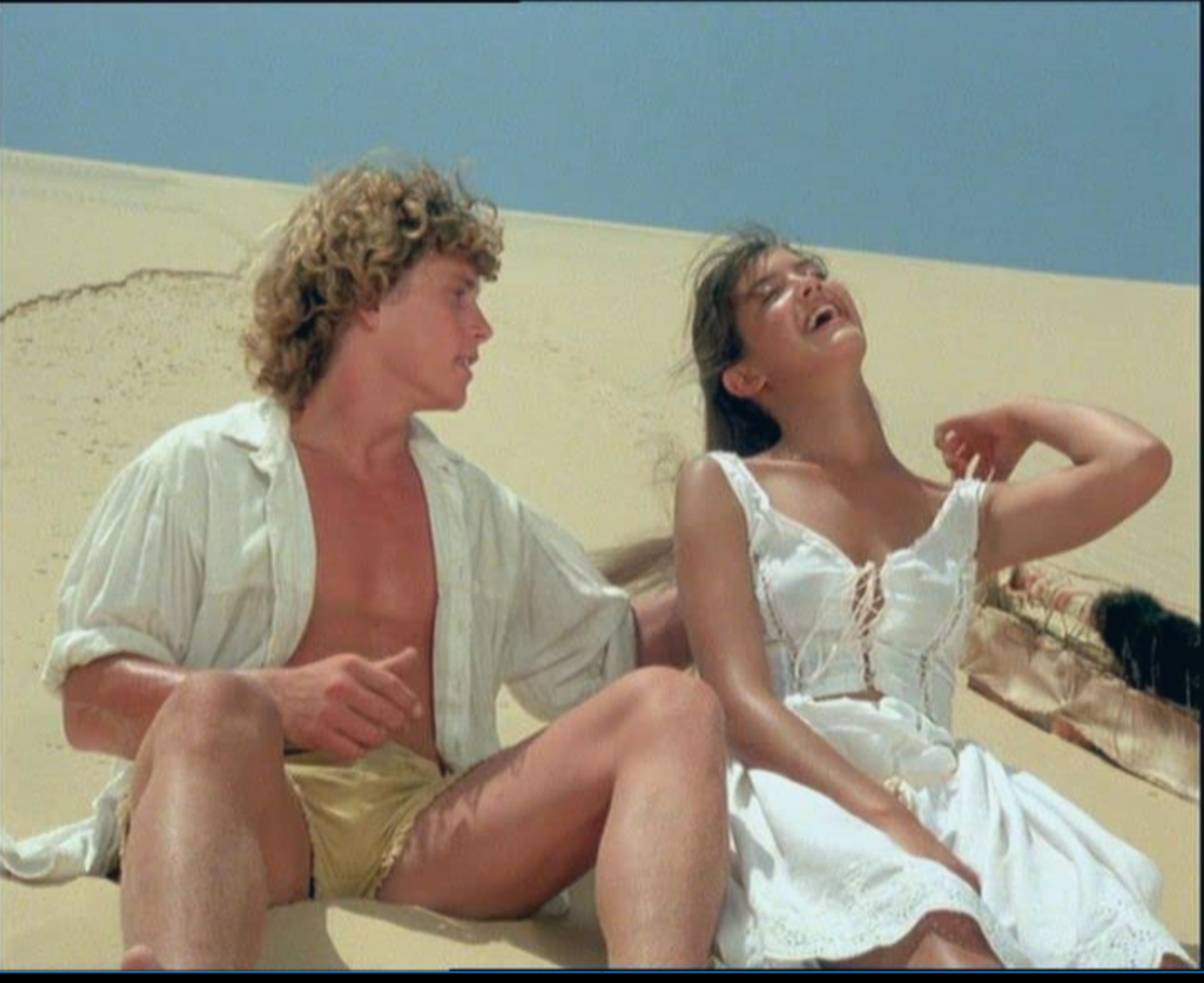Trapped in the desert David (Willie Aames) and Sarah (Phoebe Cates) laugh at chimps Doc and Evie