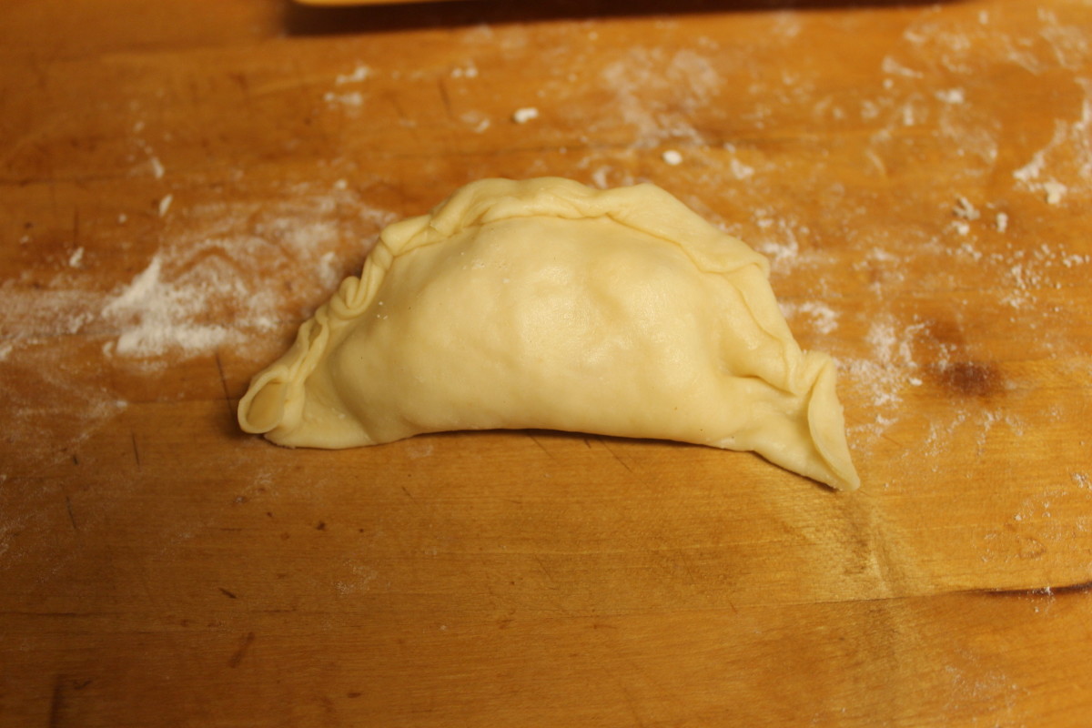 This is what the empanada shell will look like when it's filled and ready to bake.