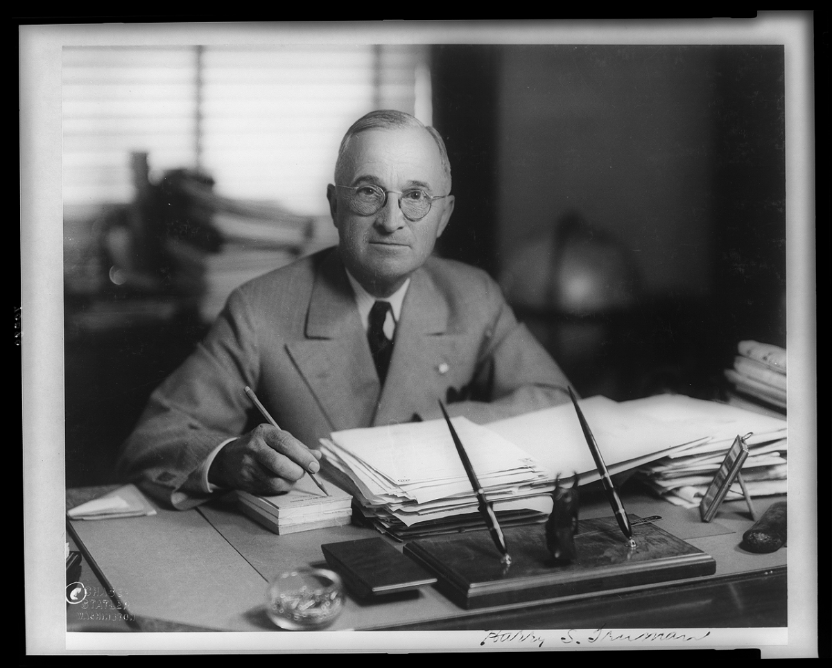 Harry Truman, half-length portrait, seated at desk, circa 1945 Chase-Statler, Washington