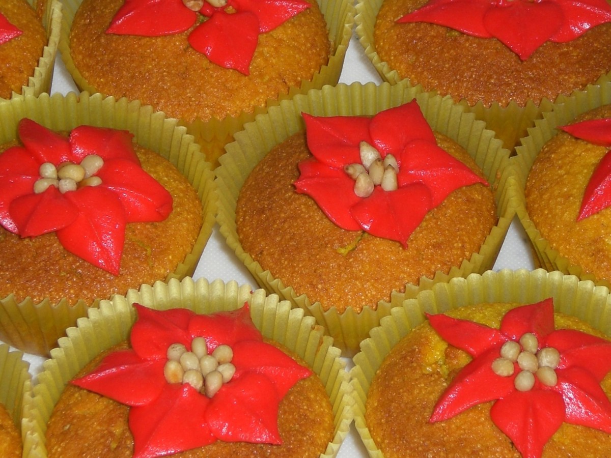  gorgeous sesame turmeric cupcakes with a rosewater frosting and topped off with pine nuts. Yummy!