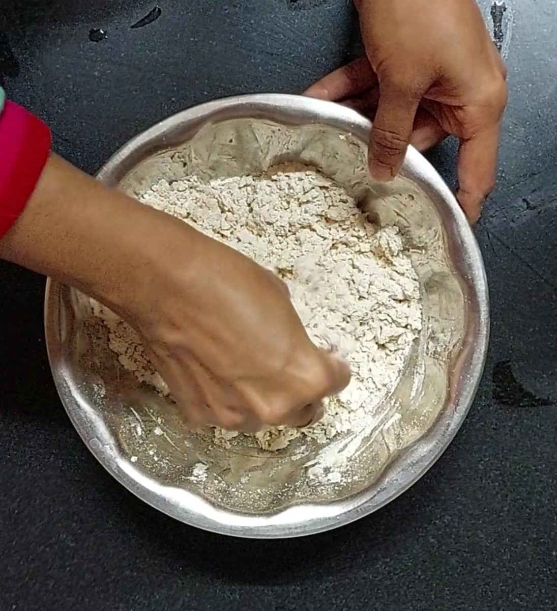 In a wide vessel, add 2 cups of wheat flour add salt. Mix well.