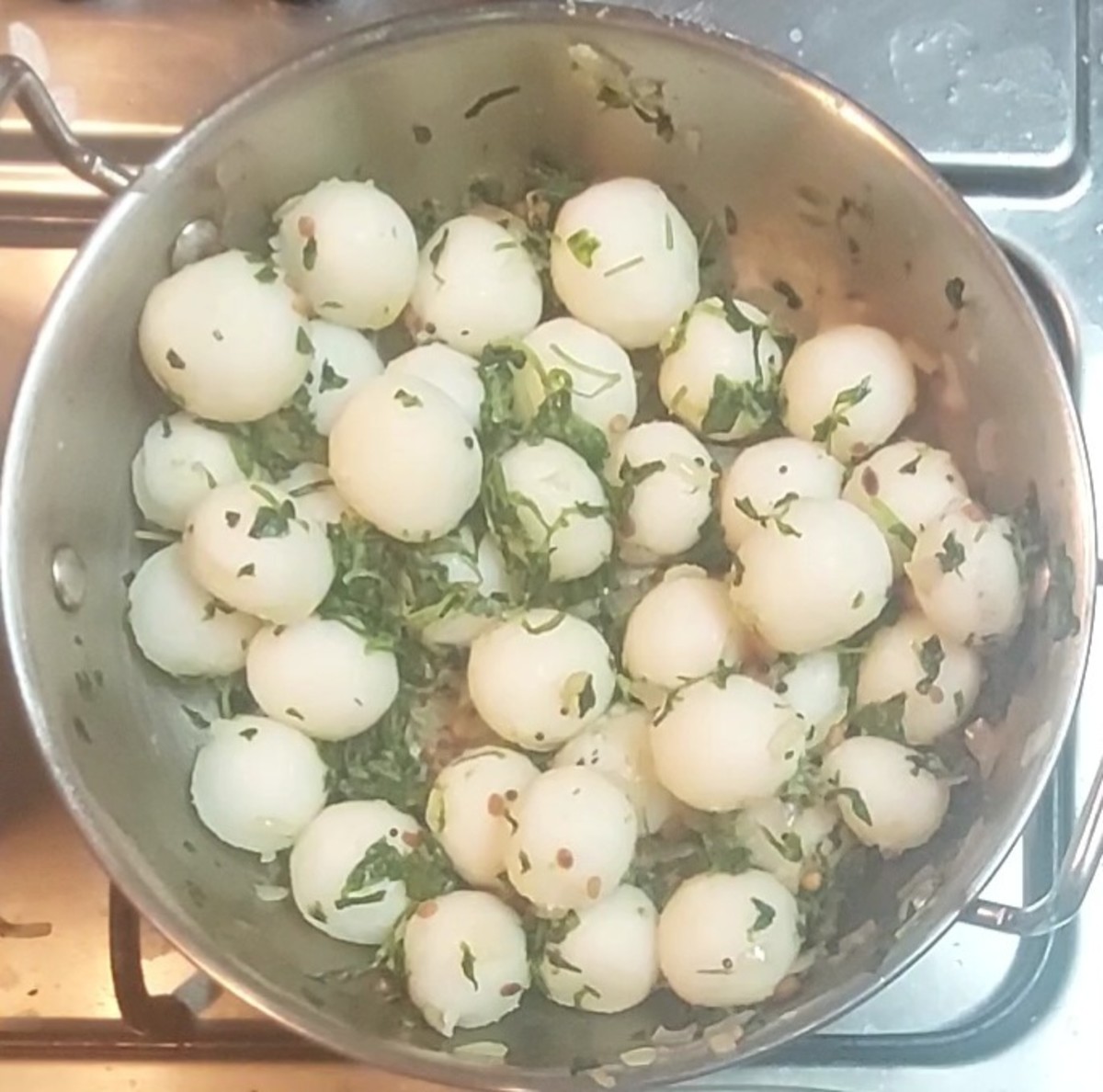 Open lid and mix once. Add steamed rice balls and mix gently without breaking the balls. Mix till methi leaves combine well with rice balls.