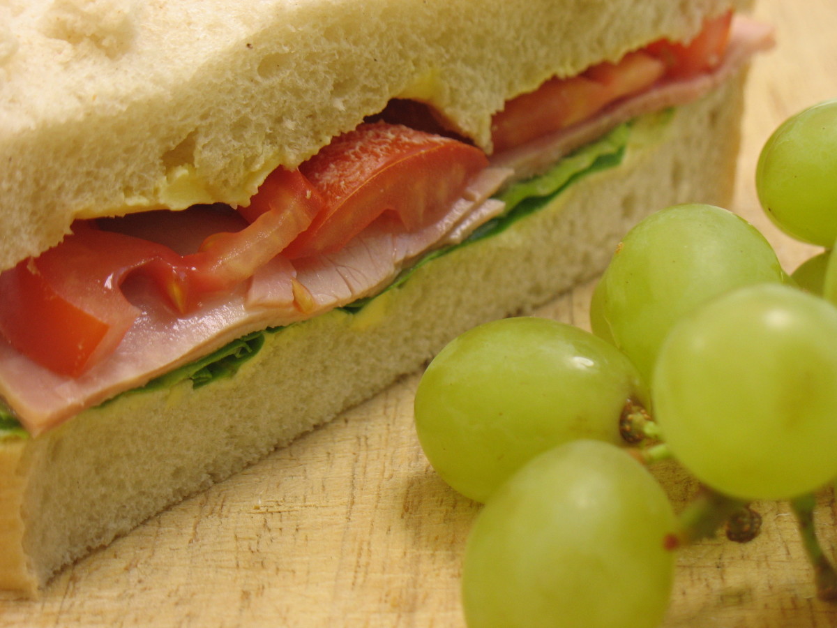 Ham and Tomato Sandwich with Grapes from Dreamstime.com