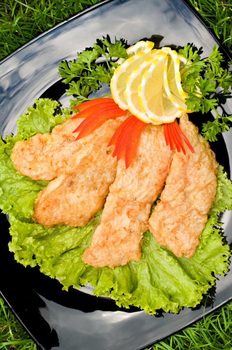 Fried Chicken Fillet on Green Salad from Dreamstime.com