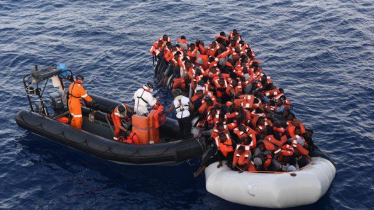 A boatload of refugees, trying to reach the coast of Italy and an Italian bout coming to help them by transferring some passengers and taking them to Italy.  