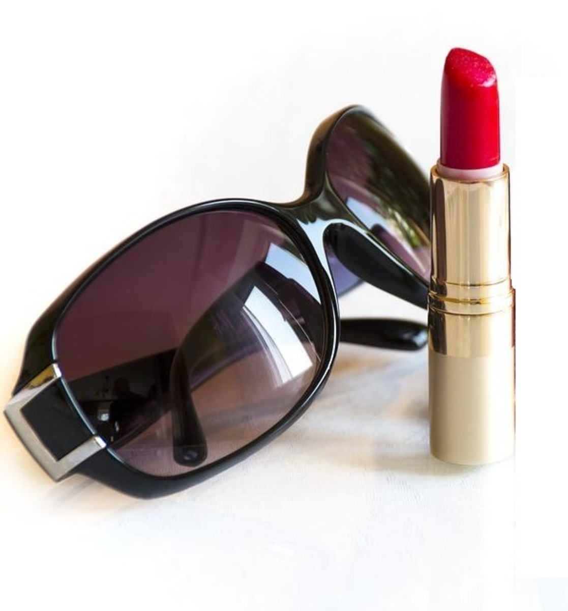 If you're short on time, all you need is a pair of dark glasses and red lipstick and you're out the door in minutes.