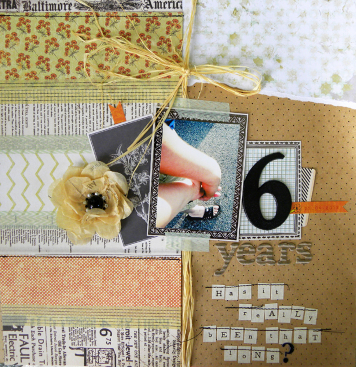 If you have added different pieces of paper on your scrapbook layout, hide the seams with some washi tape.