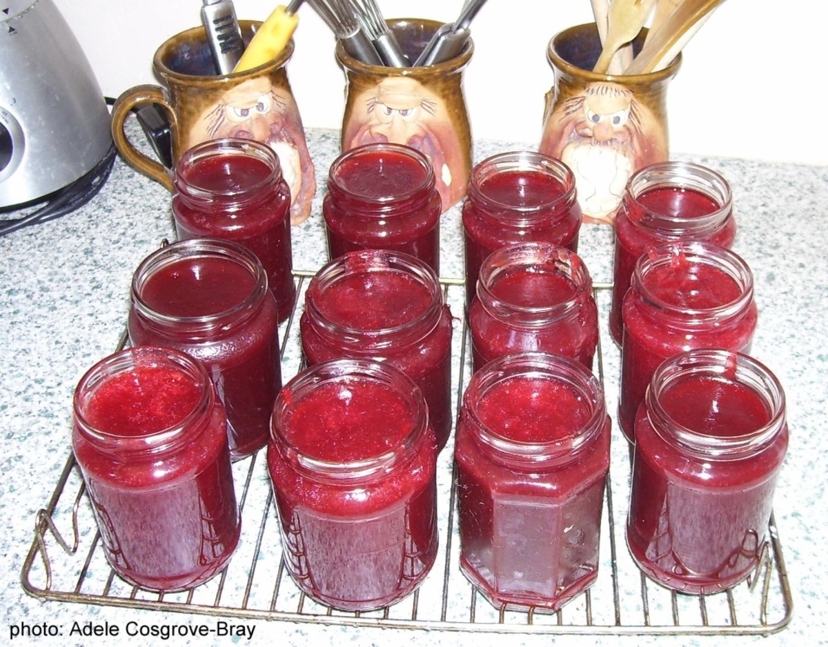 New jam in jars, awaiting wax paper seals and lids.